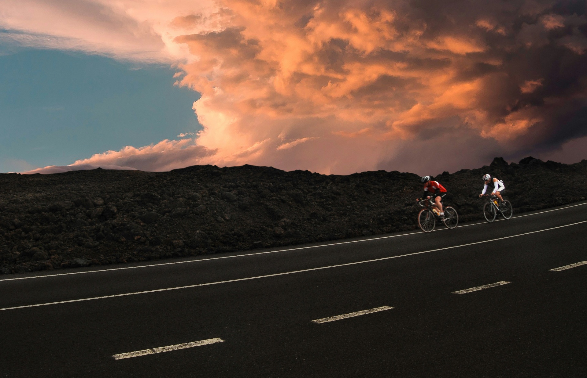 Cyclists riding through mountain scenery